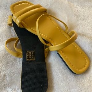 Yellow strappy flat sandals